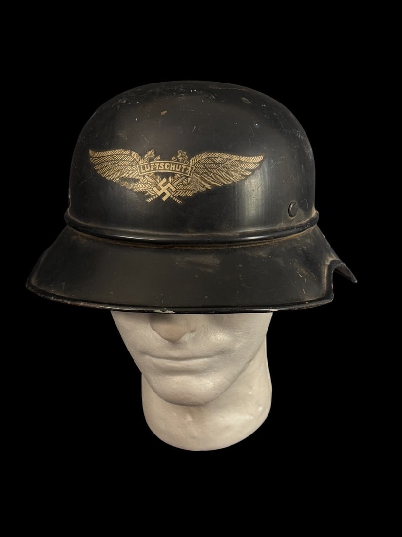 WWII German Luftschutz Gladiator Style Air Raid Helmet: Luftschutz Gladiator Style Air Raid Helmet used by members of the German Air Protection League. This lightweight helmet is characterized by its shallow crown and its distinctive, broad, multi-stage vi
