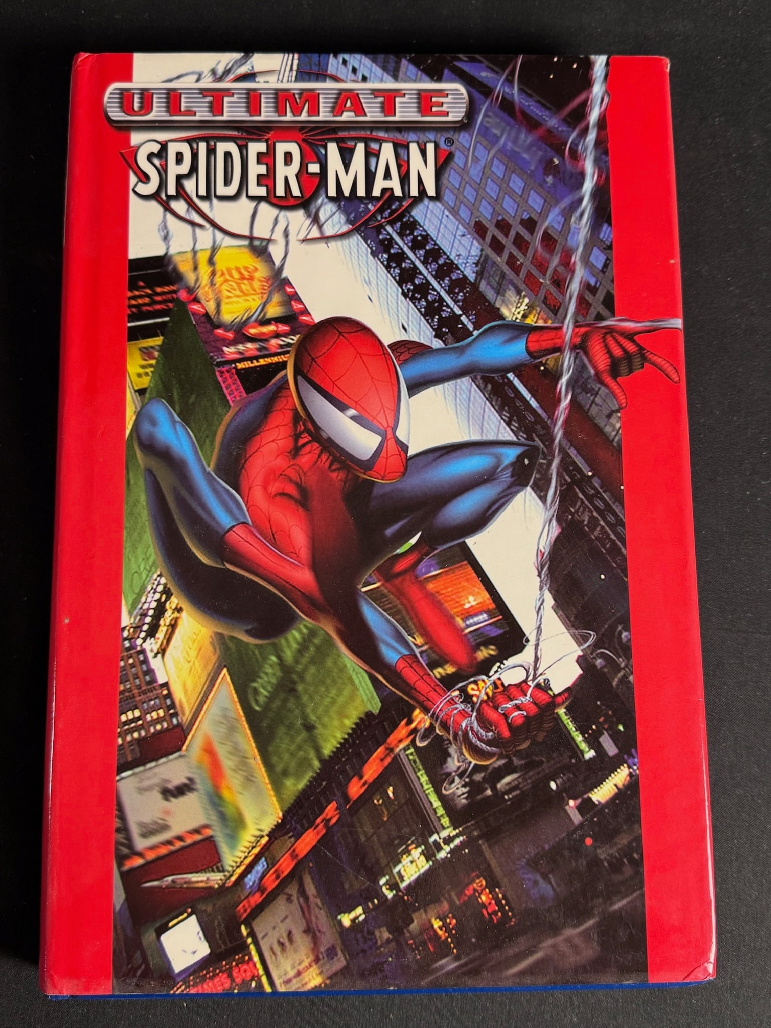 Ultimate Spider-Man Omnibus Vol. 1 Hardcover 1st Printing: Ultimate Spider-Man Omnibus Vol. 1 published by Marvel Comics. This hardcover publication features a cover illustration of the titular character swinging through a cityscape, framed by a red border.