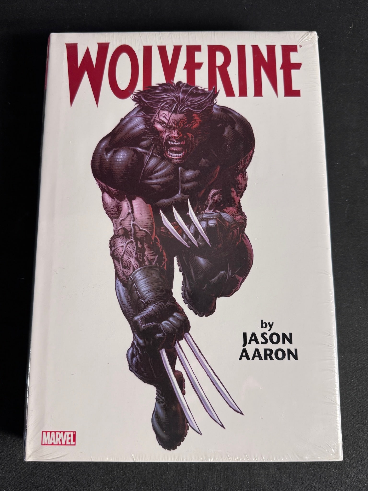 Wolverine by Jason Aaron Omnibus Volume 1 Hardcover 1st Printing: Wolverine by Jason Aaron Omnibus Volume 1 is a hardcover graphic novel collection published by Marvel. The front cover features an illustration of the title character with extended claws by artist