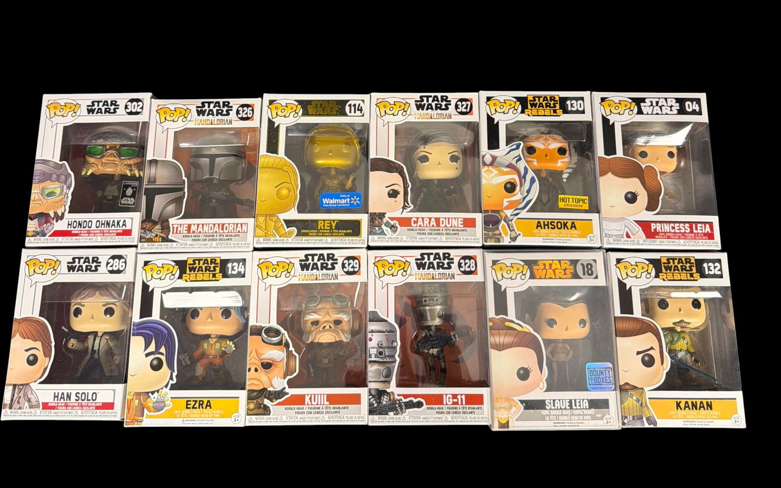 Funko Pop Star Wars Vinyl Bobble-Head Collection 12 Pieces Including Exclusives and Vaulted: This lot features a collection of twelve vinyl bobble-head figures from the Funko Pop! Star Wars line. The assortment includes characters from the original films, Star Wars Rebels, and The Mandalorian