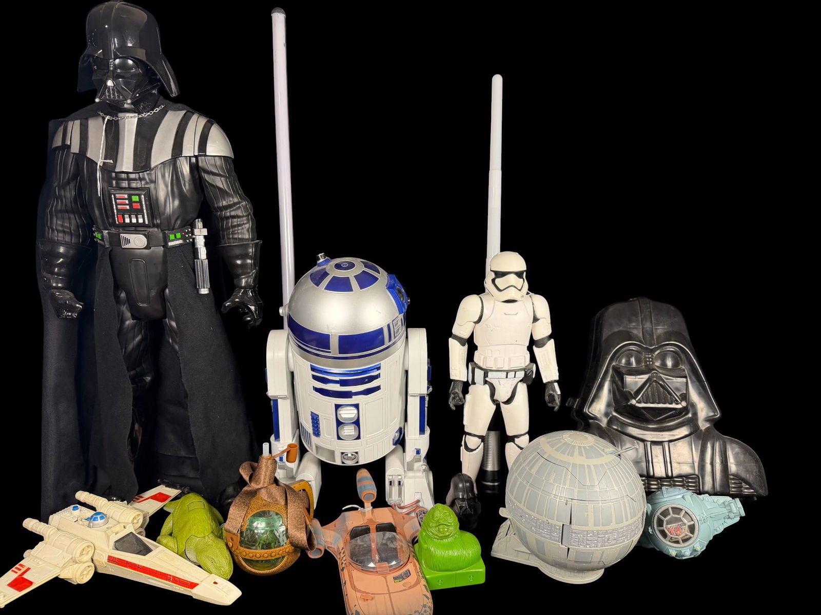 Star Wars Action Figures and Collectibles including Jakks Pacific Giant Size Figures: A collection of Star Wars-themed toys and collectibles, featuring large-scale articulated plastic action figures produced by Jakks Pacific. The group includes a 31-inch Darth Vader figure with a fabri