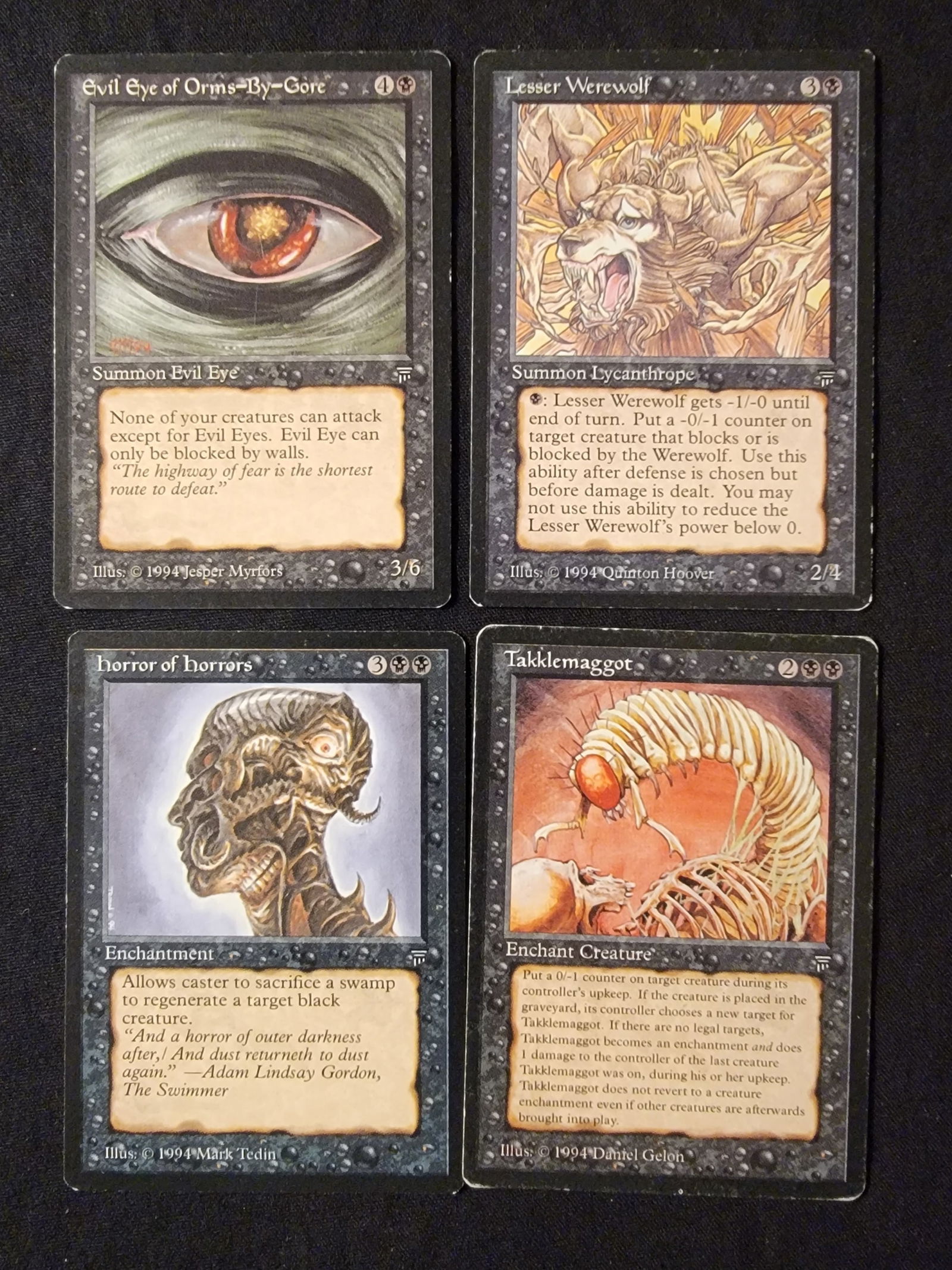 A Group of Magic The Gathering Black Legends 4: A group of original Magic: The Gathering trading cards from the 1994 Legends expansion set. The collection includes cards titled Evil Eye of Orms-By-Gore, Lesser Werewolf, horror of horrors, and Takkl