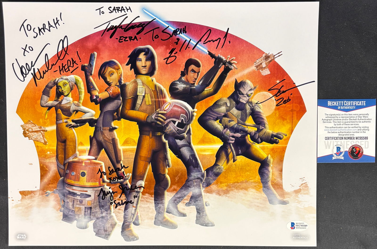 Star Wars Rebels Cast Multi-Signed Topps Authentics Color Print: This color print features the primary ensemble cast from the animated series Star Wars Rebels, including characters Hera Syndulla, Sabine Wren, Ezra Bridger, Kanan Jarrus, Garazeb Zeb Orrelios, and