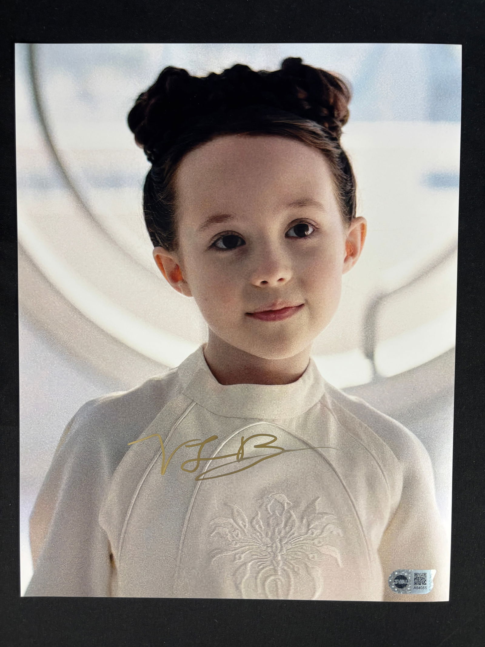Vivien Lyra Blair Signed Obi-Wan Kenobi Princess Leia Photograph with SWAU Authentication: This lot consists of a color photographic print featuring actress Vivien Lyra Blair in her portrayal of young Princess Leia Organa from the television series Obi-Wan Kenobi. The photograph is signed