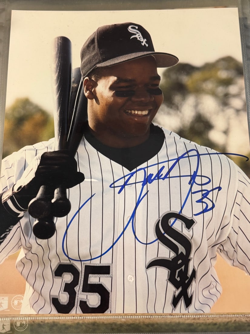 Frank Thomas Autographed Chicago White Sox Color Photograph: A color photograph featuring Major League Baseball player Frank Thomas in a Chicago White Sox home pinstripe jersey and cap. (GTPTPA) Guaranteed to pass third-party authentication