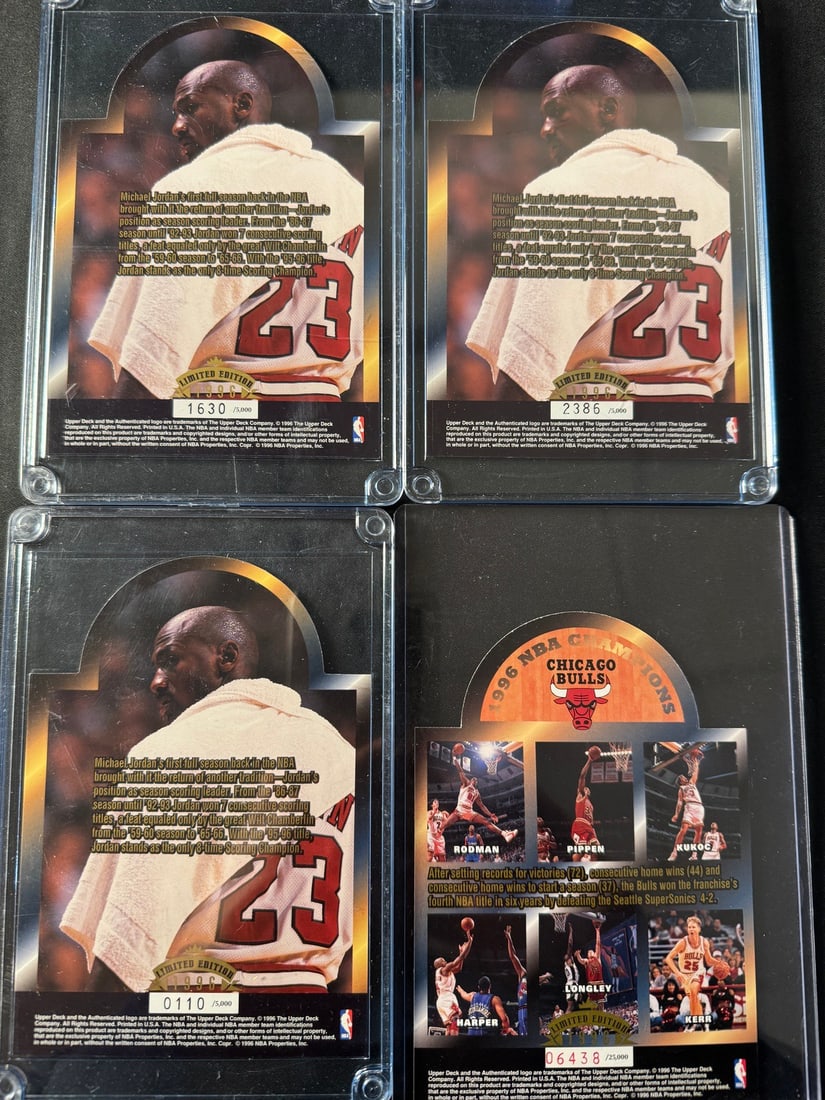 1996 Upper Deck Michael Jordan 8-Time Scoring Champion - Chicago Bulls NBA Champions Cards: A collection of Upper Deck commemorative basketball cards from 1996, celebrating Michael Jordan and the Chicago Bulls NBA championship season. Several cards feature a portrait of Michael Jordan from t
