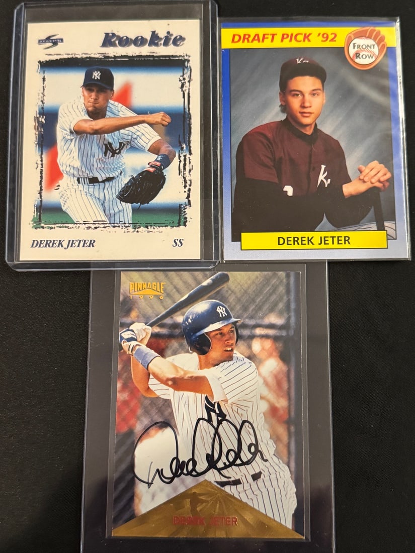 Derek Jeter Autographed Baseball Card and 1996 Score Rookie 240: A trio of Derek Jeter baseball cards featuring the Hall of Fame shortstop during his early professional career. The collection includes a 1996 Score #240 Rookie card depicting Jeter in a New York Yank