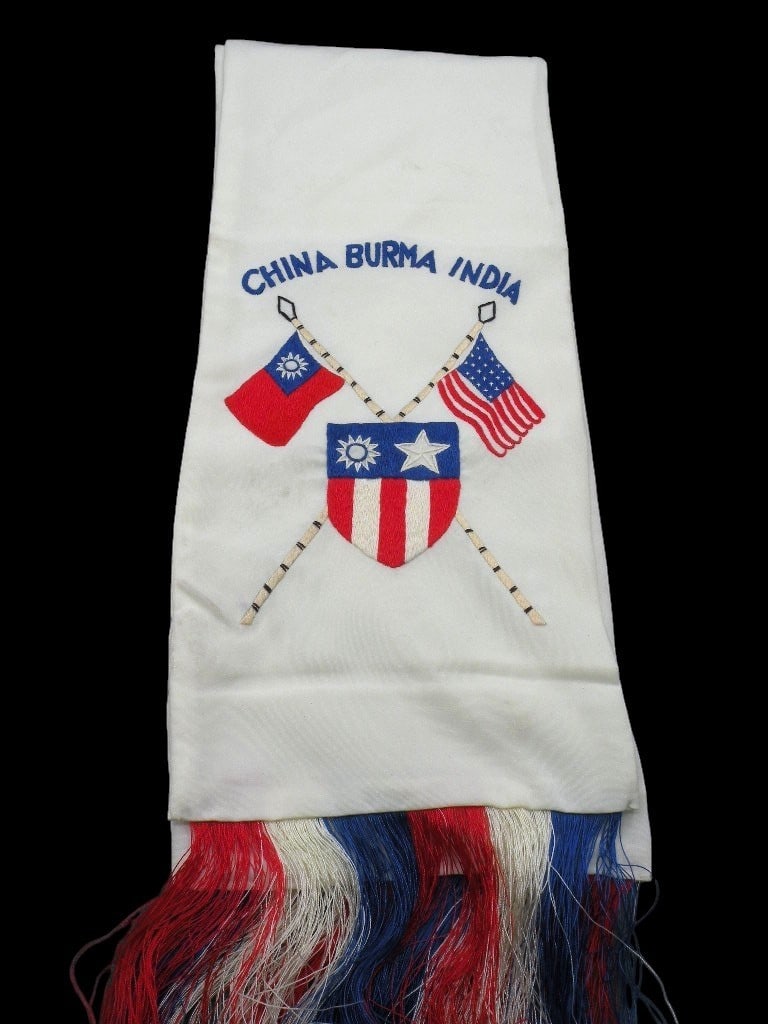 14th AAF Silk Scarf: A World War II era China-Burma-India (CBI) Theater souvenir scarf, circa 1941-1945. The scarf is constructed from a lightweight, fine-weave white fabric with a slight sheen, consistent with silk or ra
