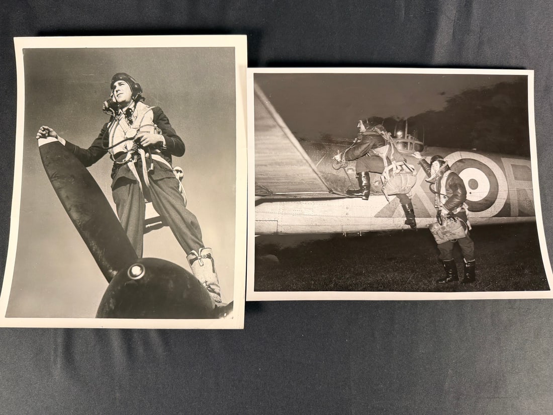 WWII Battle of Britain Photos: This lot consists of two original black and white silver gelatin publicity photographs produced for the 1956 biographical film Reach for the Sky. The photographs depict scenes and promotional poses ba