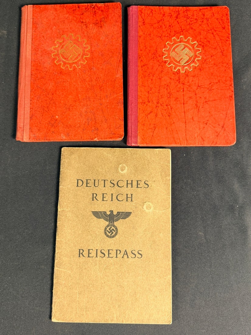 WWII German Documents and Passbook Group: This lot consists of three original Third Reich-era documents including two Deutsche Arbeitsfront (DAF - German Labor Front) membership books and one Deutsches Reich Reisepass (Passport). The DAF memb