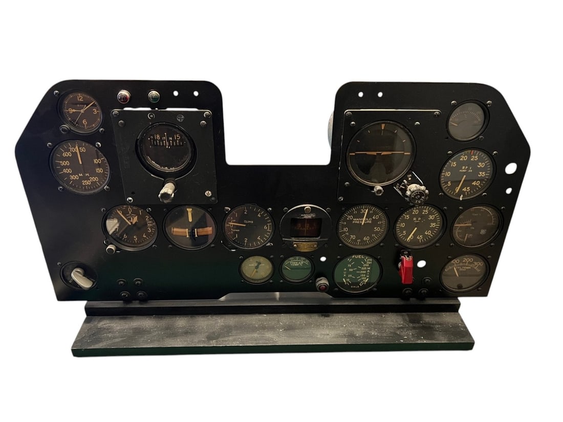 WWII P-47 Cockpit Panel with Gauges - Complete and Rare: This is a main instrument panel for a World War II P-47 Thunderbolt fighter aircraft. The panel is constructed of heavy-gauge metal featuring a black crinkle-finish coating and is mounted on a modern