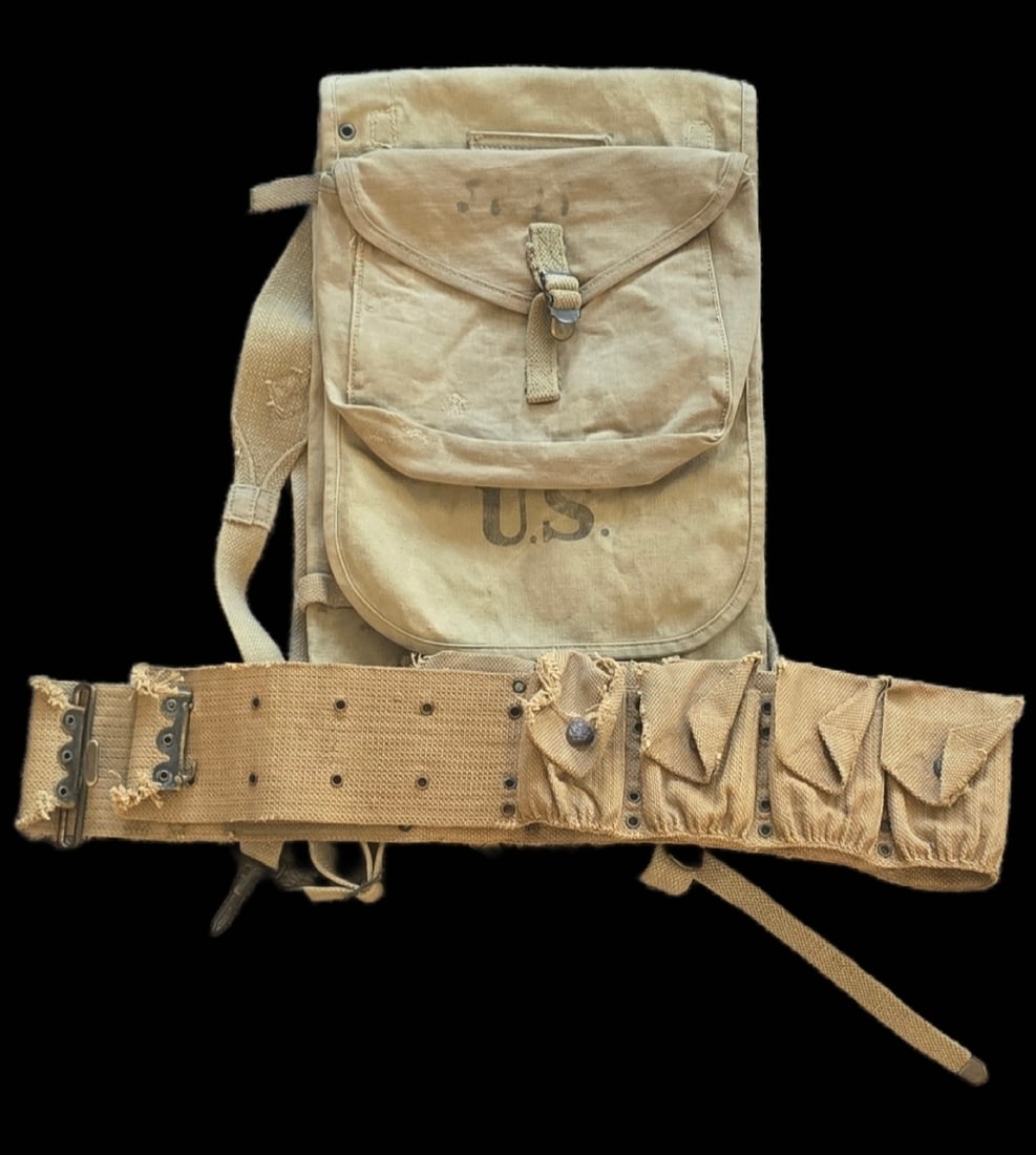 WWI US Army Mills Belt and M1910 Haversack: This lot consists of two pieces of United States Army infantry field equipment constructed from heavy-duty khaki cotton canvas webbing. The first item is an M1910 haversack, a pattern used extensively