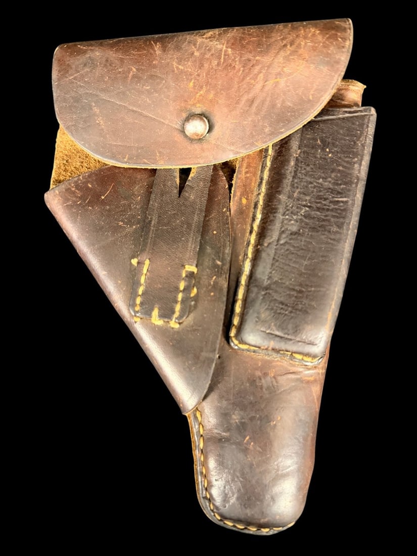 WWII German Walther PPK Leather Holster: A German military-issue holster designed for 7.65mm caliber semi-automatic pocket pistols, such as the Walther PPK, Mauser HSc, or Sauer 38H. The holster is constructed from brown leather and features