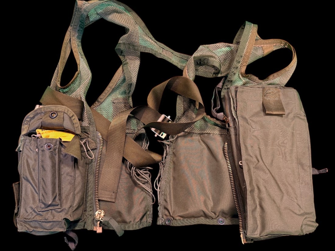 1970s - 1980s SRU-21 P Aircrew Survival Vest: This is a US military issue SRU-21/P aircrew survival vest, a standard load-bearing garment utilized by pilots and flight crews during the late 20th century, including the Cold War and Persian Gulf Wa