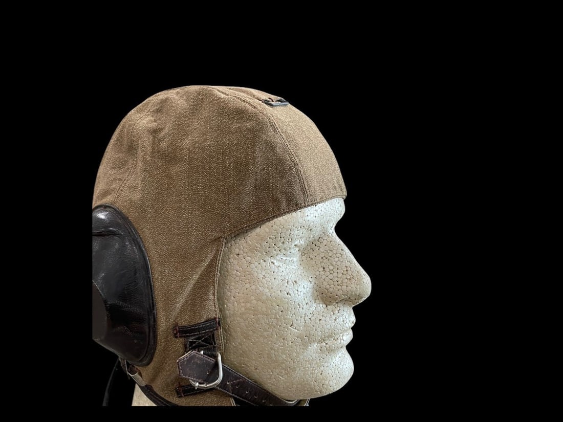 WWII German Luftwaffe LKpS 101 Summer Flight Helmet Complete: This is a World War II German Luftwaffe LKp S 101 summer-weight flying helmet, also known as a Fliegerkopfhaube. The helmet is constructed from tan heavy-weave cotton canvas with dark brown leather-co