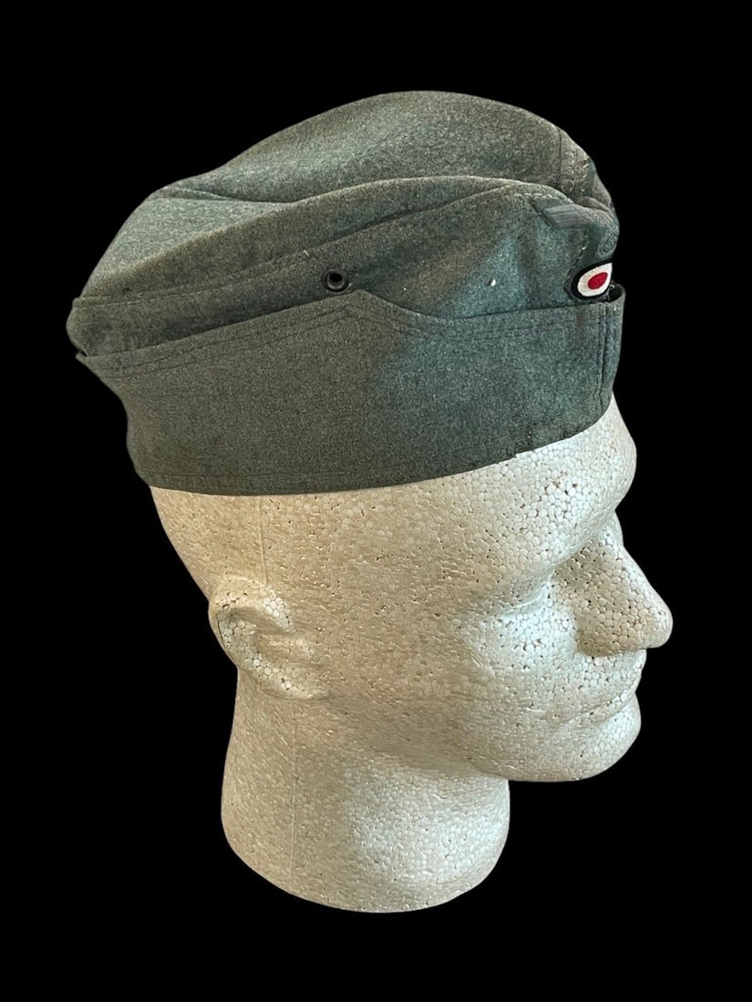 WWII German Army Heer EM NCO M43 Overseas Cap: This is a German Army (Heer) Enlisted Men (EM) and Non-Commissioned Officers (NCO) M34 overseas field cap, also known as a Schiffchen. The exterior is constructed from standard-issue feldgrau wool and