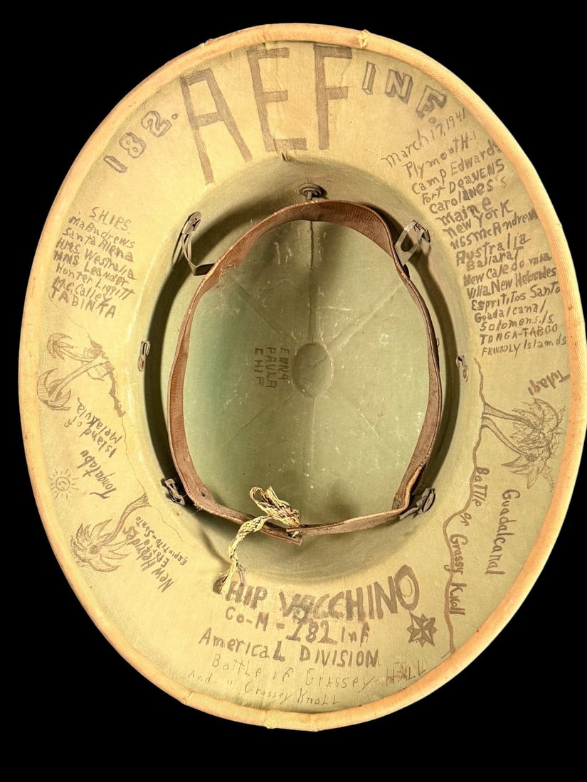 WWII US Army Pith Helmet Signed - 182nd Inf. Reg: A World War II era US Army M1941 pattern pressed fiber sun helmet featuring a tan khaki fabric covering and a brass US collar insignia pinned to the front. The interior brim is extensively hand-inscri