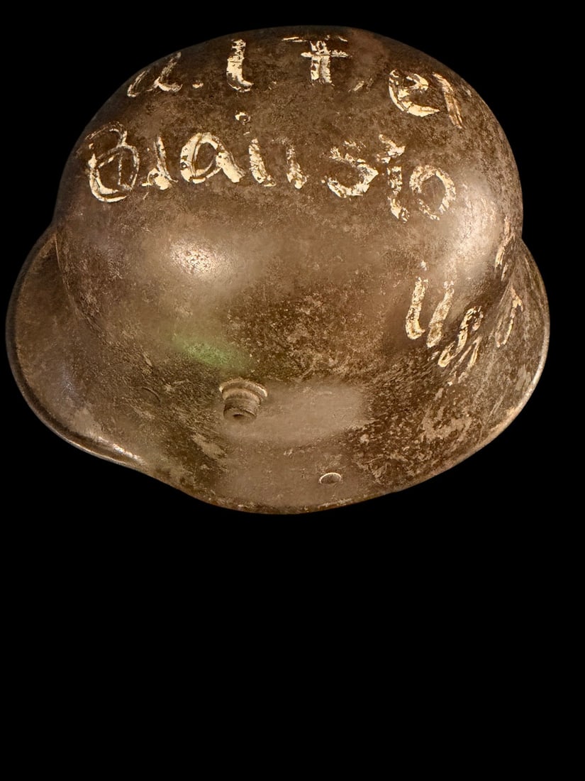 WWI M16 German Helmet Painted Bring Back with History: This Imperial German Model 1916 (M16) Stahlhelm is a documented war trophy from the First World War. The steel shell is stamped ET64 along the inner brim, indicating manufacture by Eisenhuettenwerke,