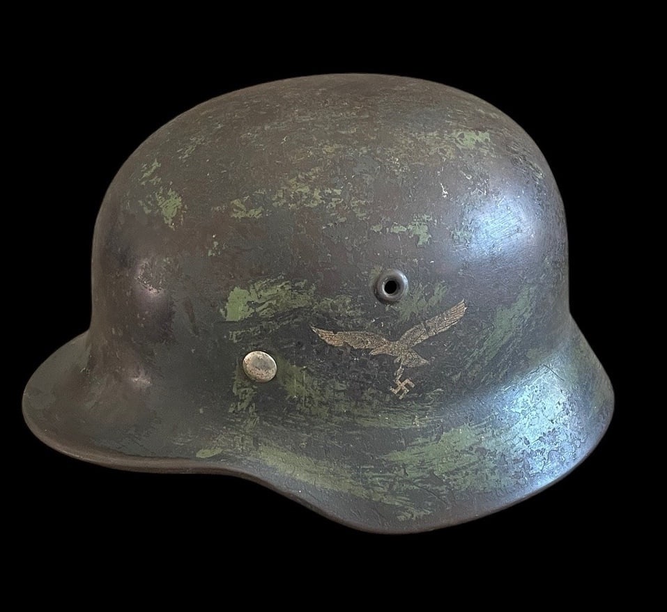 Luftwaffe M40 SD Camo Helmet: Outstanding German WWII M40 Single Decal Luftwaffe Combat Helmet with Field Camouflage and NamingThis lot offers an exceptional and highly personalized example of a German Model 1940 M40 Single Decal
