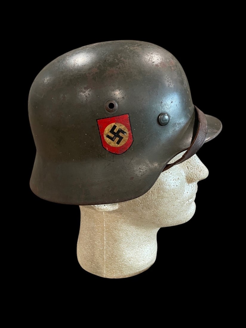 WWII German M35 DD Police Outstanding: This is a German Stahlhelm Modell 1935 (M35) double decal police helmet manufactured by Eisenhuettenwerke in Thale. The shell is constructed of stamped molybdenum steel featuring the characteristic re