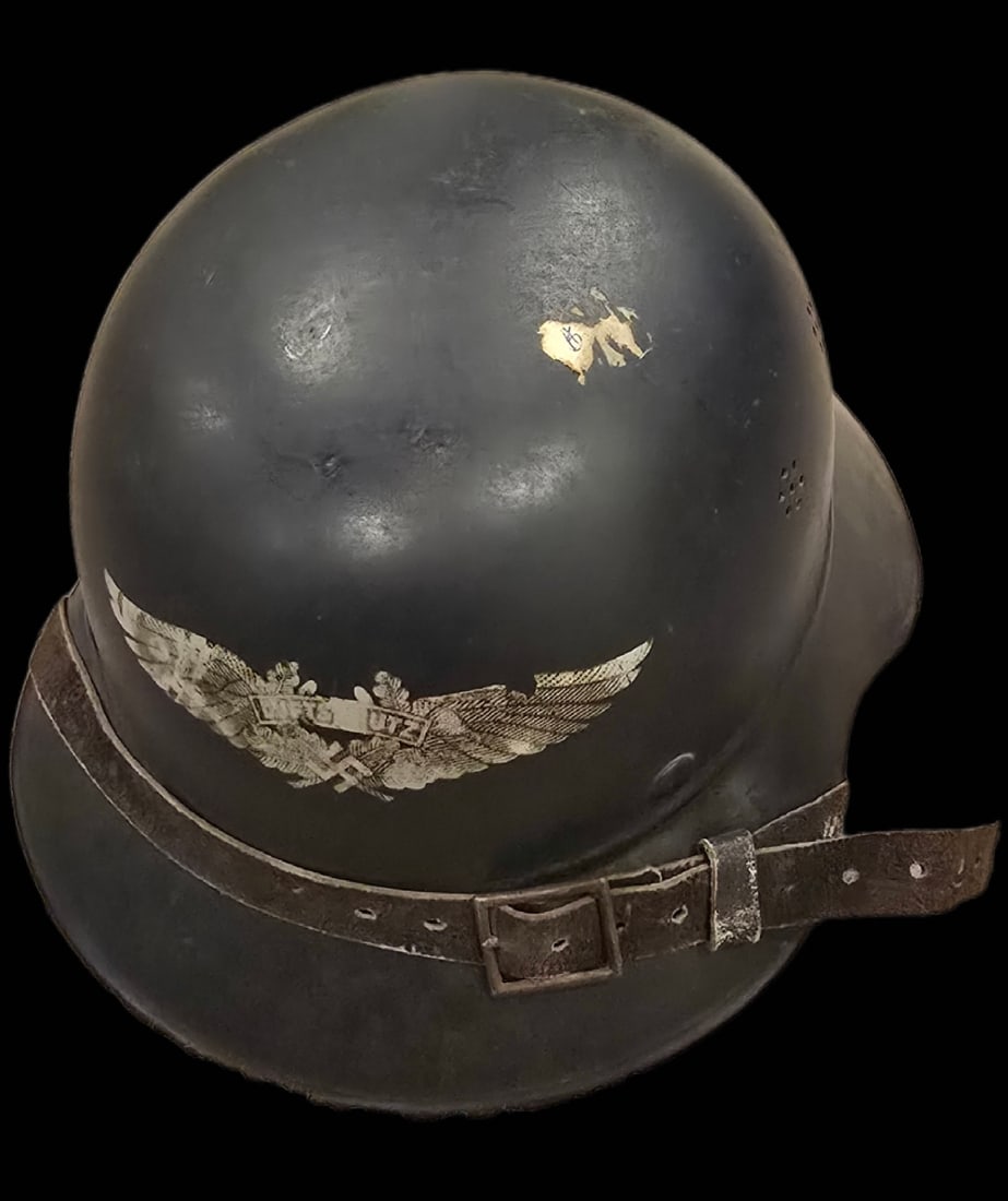 WWII German Luftschutz Gladiator Helmet: German Luftschutz civil defense helmet in the M38 Gladiator pattern. The item features a three-piece steel construction consisting of a crown, visor, and neck guard joined by a prominent horizontal be