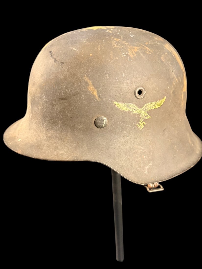 WW2 German Luftwaffe SD M40 Helmet: German Model 1940 (M40) steel combat helmet (Stahlhelm) produced for the Luftwaffe. The shell features a rolled edge and integral, embossed ventilation holes characteristic of the M40 pattern. The ext