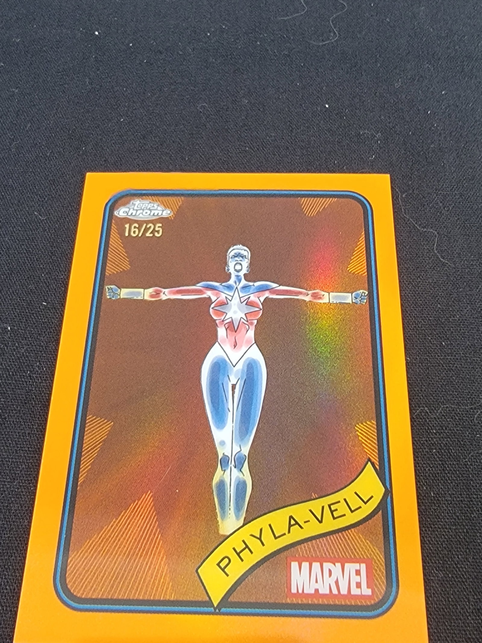 2025 Topps Chrome Marvel Phyla-Vell Orange Refractor Serial Numbered 16/25 Card 78: This is a 2025 Topps Chrome Marvel trading card featuring the character Phyla-Vell. The card is number 78 in the set and is the Orange Refractor parallel version. The front of the card displays a full