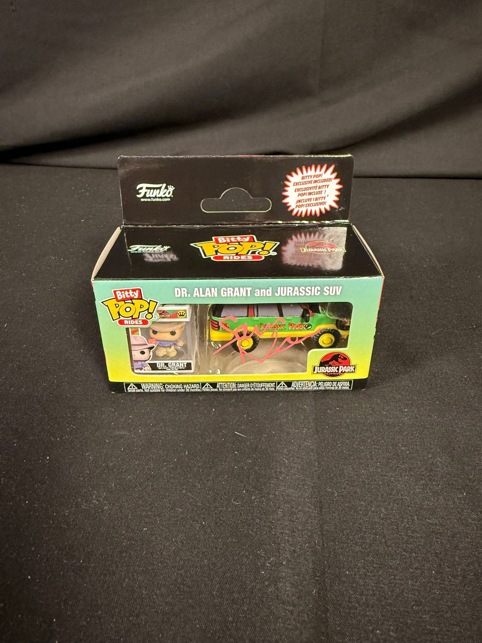 Dr. Alan Grant and Jurrasic SUV Signed Pop Bitty Ride: Sam Neil signed Dr. Alan Grant and Jurrasic SUV Pop Bitty Rides with COA