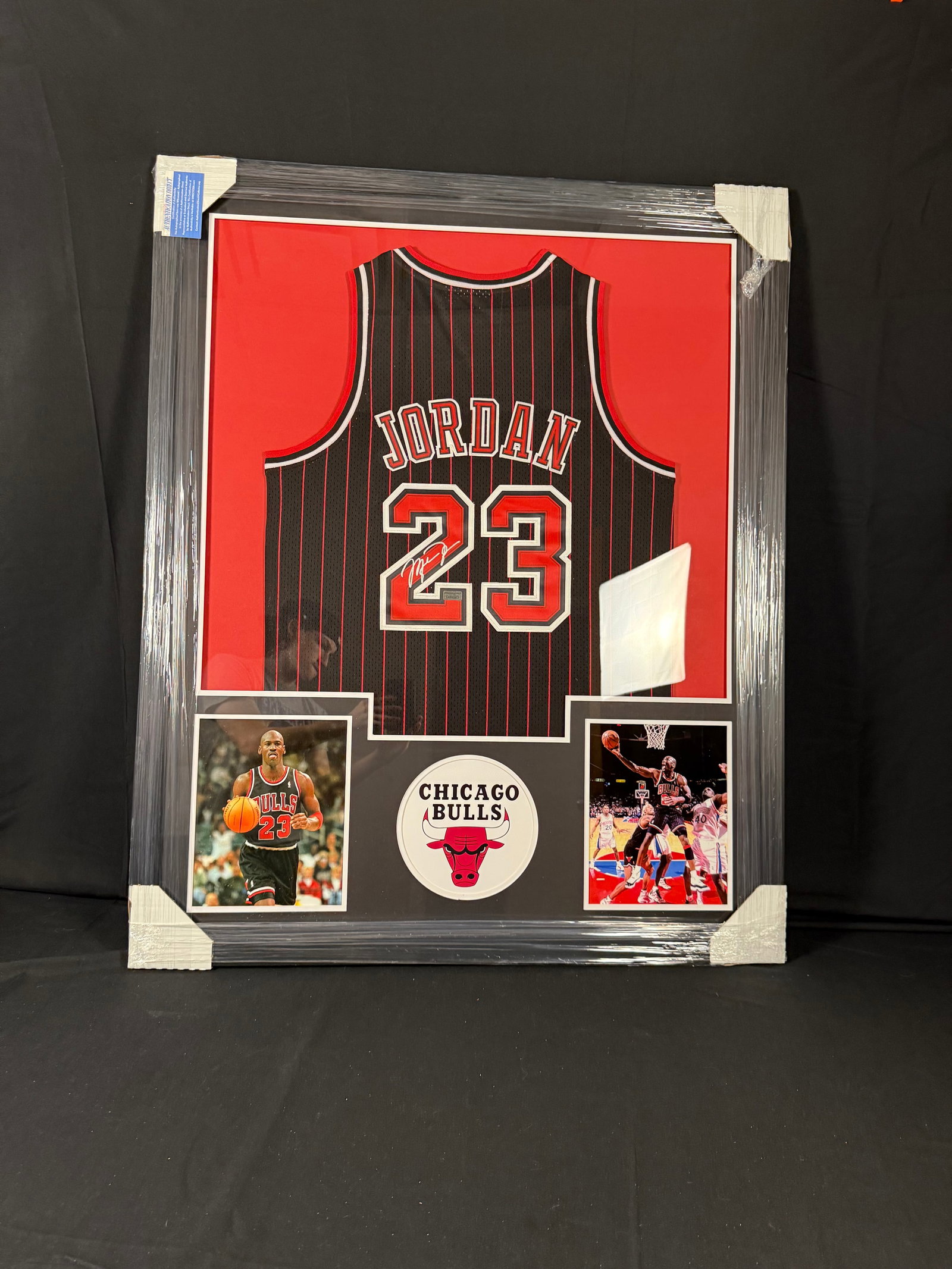 Michael Jordan Signed Chicago Bulls '96-'97 Framed Jersey: Signed framed Michael Jordan 1997-'98 Chicago Bulls jersey with COA