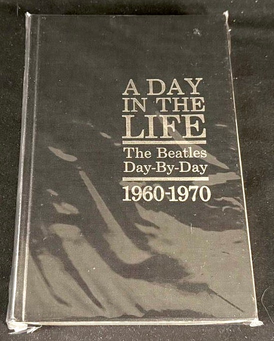 A Day in the Life: The Beatles Day-By-Day 1960-1970 (Pocket Reference Book): Compact hardcover reference book presenting a chronological day-by-day timeline of the Beatles' career from their formative years through the group's breakup.