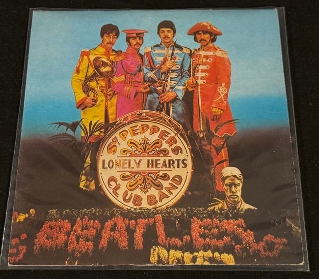 Italian 1978 Beatles "Sgt. Pepper's Lonely Hearts Club Band" Single: Italian EMI 7-inch single featuring Sgt. Pepper's Lonely Hearts Club Band / With a Little Help From My Friends, backed with A Day in the Life. Complete with its colorful original Italian picture sleev