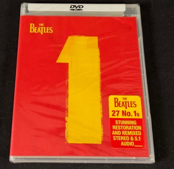 The Beatles 1 DVD: Factory sealed DVD edition of The Beatles 1 featuring restored promotional films for the band's 27 No. 1 hits.