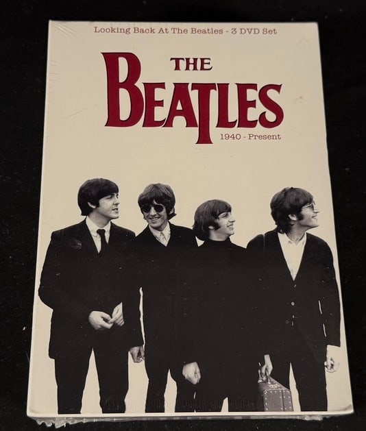 The Beatles: Looking Back at The Beatles 3-DVD Set: Factory sealed 3-DVD retrospective documentary covering the Beatles from 1940 to the present.