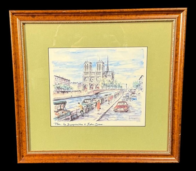 Framed Paris 'Bouquinistes at Notre-Dame': Full title: Framed Paris 'Bouquinistes at Notre-Dame' Watercolor Framed watercolor illustrating the famous booksellers along the Seine with Notre-Dame Cathedral in the background. 17"x16"