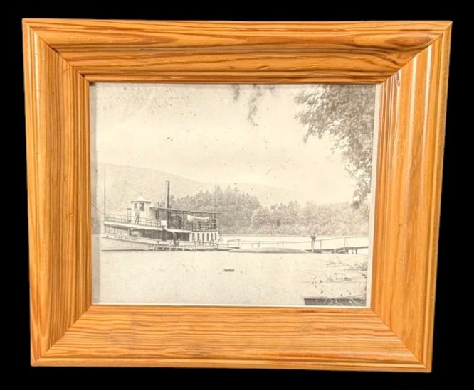 Steamboat on Lake Framed Vintage Photograph: Framed vintage black-and-white photograph depicting an early steamboat docked along a lakeshore. 14"x12"