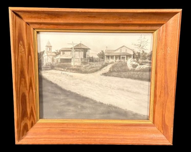 Borodino, New York Framed Vintage Photograph: Framed vintage black-and-white photograph labeled 'Borodino,' depicting an early streetscape featuring homes, a church, and unpaved road. 13"x11"