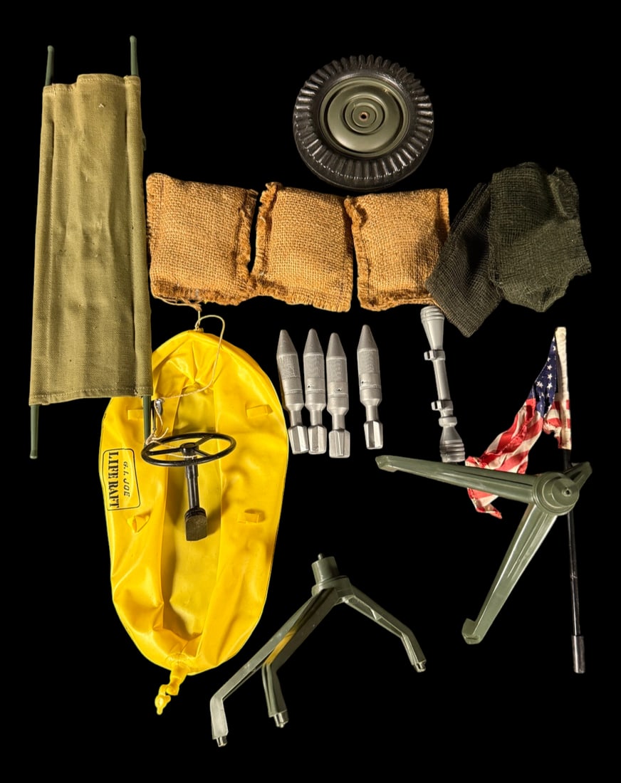 Vintage G.I. Joe Accessories: Vintage G.I. Joe accessories including rockets, sandbags, stretcher, wheel, flags, tripods, and additional field equipment.