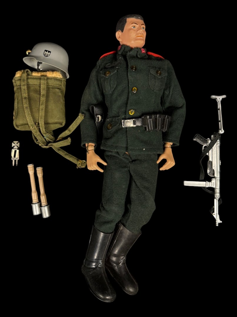 Vintage 1964 G.I. Joe German Soldier Figure: 1964 Hasbro G.I. Joe German soldier figure dressed in dark green uniform with Stahlhelm-style helmet, submachine gun, backpack, stick grenade, and additional field accessories.