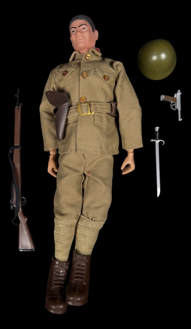 Vintage 1964 G.I. Joe Japanese Soldier Figure: 1964 Hasbro G.I. Joe Japanese soldier figure wearing tan uniform with rifle, bayonet, helmet, and holstered machete. A nice complete display example.