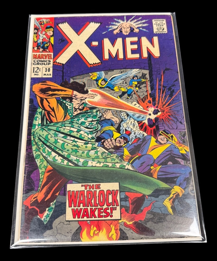 X-Men #30 - 'The Warlock Wakes!' Silver Age: Full title: X-Men #30 - 'The Warlock Wakes!' Silver Age Marvel, 1967 Original Marvel X-Men #30, March 1967, featuring 'The Warlock Wakes!' with a classic Jack Kirby cover.
