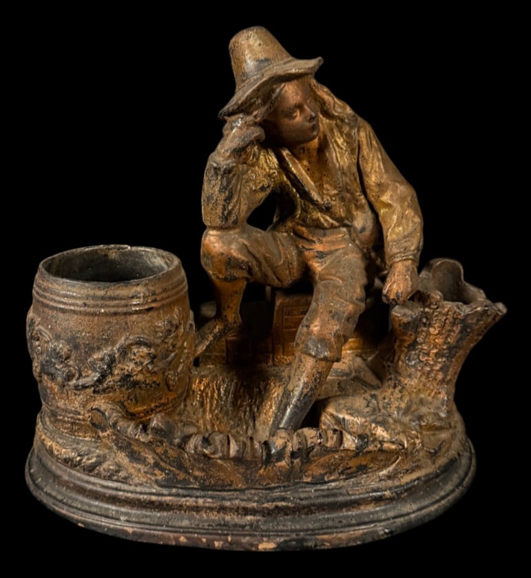 Antique English Terracotta Figure: Antique English terracotta figural desk accessory depicting a seated gentleman in period attire beside an integrated pen or pencil holder.