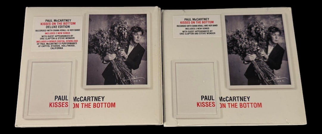 Paul McCartney Kisses on the Bottom Deluxe: Full title: Paul McCartney Kisses on the Bottom Deluxe Editions (2) Two sealed deluxe editions of Paul McCartney's Kisses on the Bottom, featuring bonus tracks and collectible packaging.