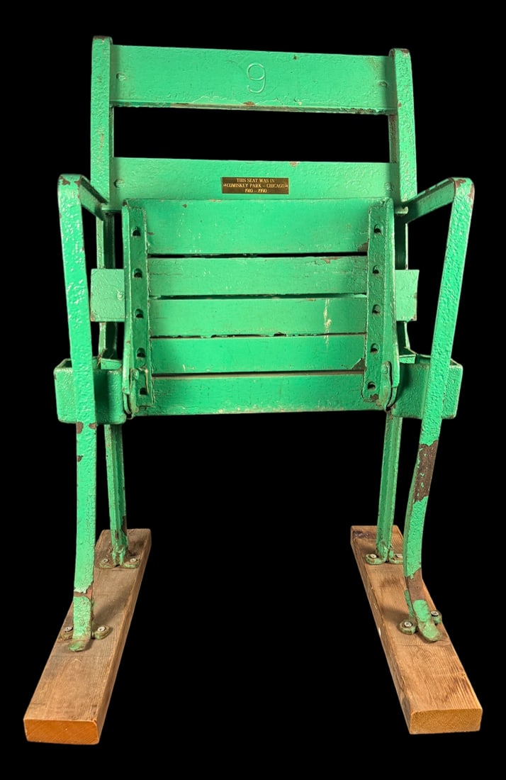 Comiskey Park Chicago Stadium Seat No. 9: Green painted wood and metal folding stadium seat bearing the number '9.' A brass plaque on the chair reads, 'This Seat Was in Comiskey Park - Chicago - 1910-1990.'
