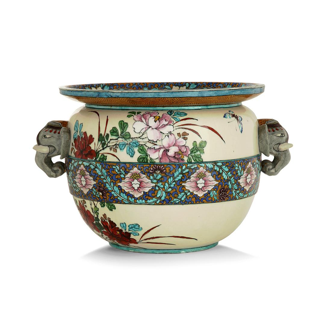 THÉODORE DECK (1823-1891), JARDINIÈRE: THÉODORE DECK (1823-1891), JARDINIÈRE CIRCULAIRE, VERS 1870 en faïence munie de deux anses en forme de tête d'éléphant, à décor polychrome d'une frise de fleurs