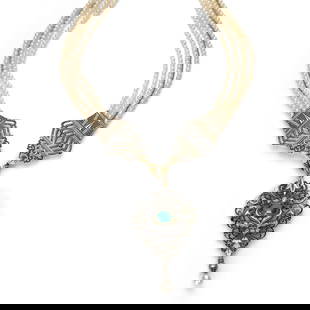 CARLO GIULIANO - ANNÉES 1880: CARLO GIULIANO - ANNÉES 1880 RARE COLLIER VOLUTES Il retient au centre un pendentif losangique repercé de volutes et feuillages émaillés noir et blanc. Au centre une tourmaline ver
