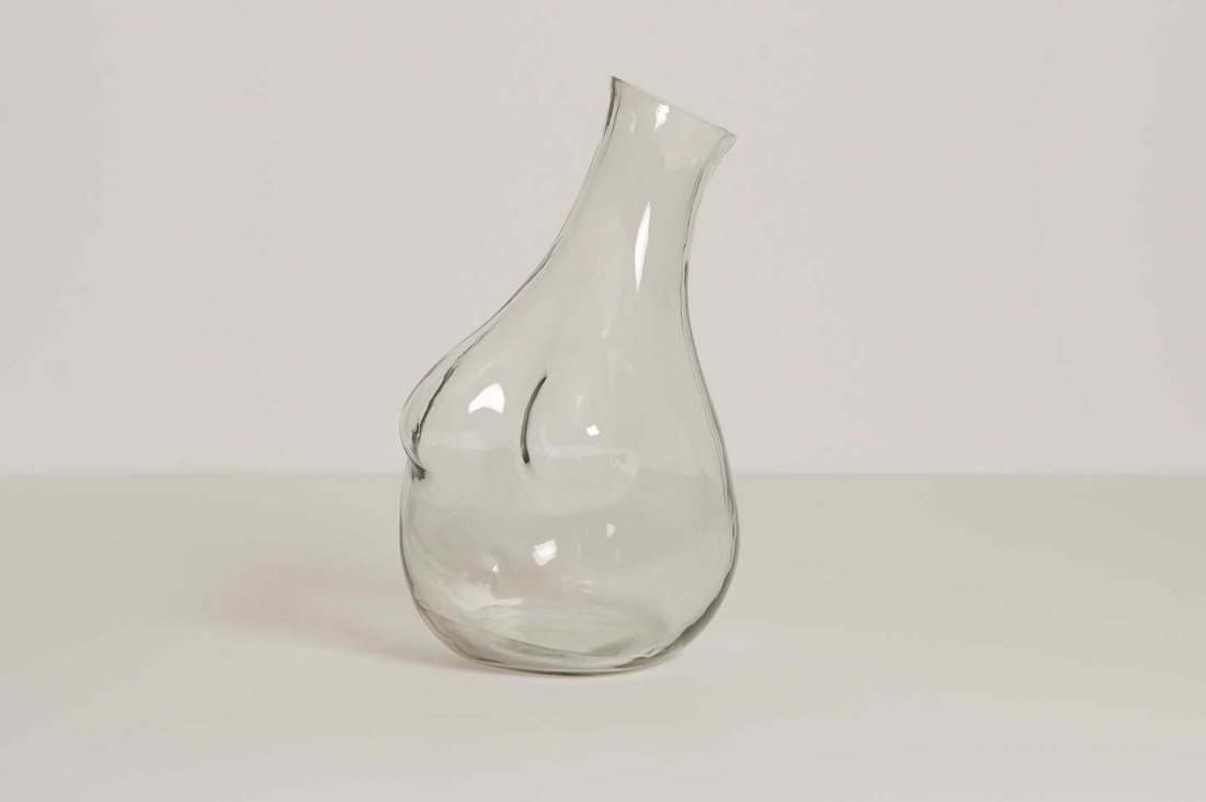 Bedside Carafe & Boob Carafe Bundle by Anna Karlin: Bedside Carafe: the perfect size for bedside use, the carafe top doubles as a cup. Dimensions: W 3 x H 8 in. Holds 44 oz to the cylinder neck. Boobs Carafe: Clear hand blown glass for water, or anythi