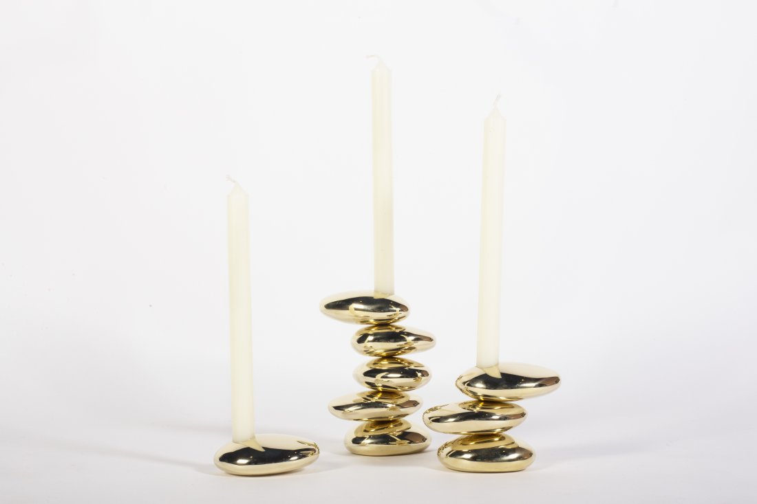 Stone Candleholders by Konekt - Set of Three: Konekt's Stone Candle Holders are inspired by the curves and contours of stones shaped by the ocean. The solid brass candle holders are cast at a Pennsylvania foundry from hand-shaped forms and are po