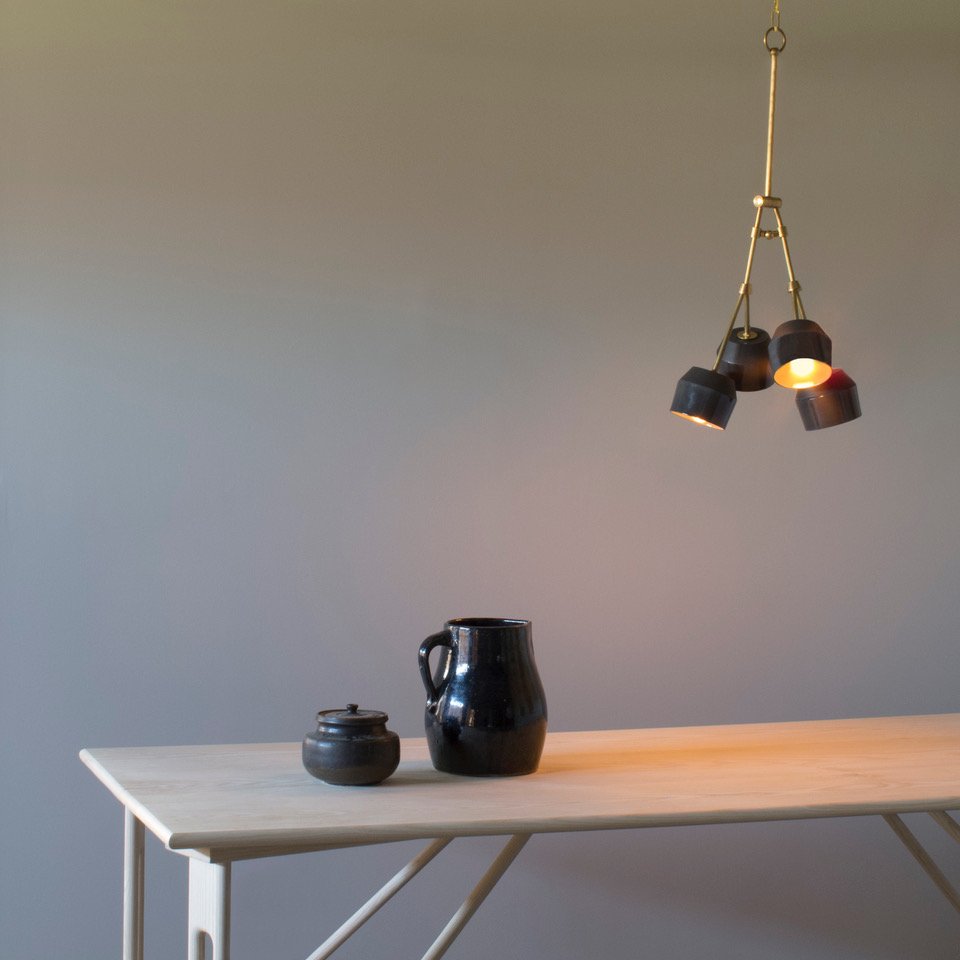 Forchette Pendant by Materia Design (2/2): The Forchette pendant is at once organic and urbane. Composed of four lithe brass arms which bloom with hand cast porcelain shades, the Forchette pendant was inspired by a collaboration with ceramicis