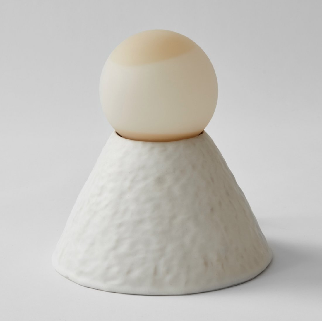 GH x MVNGMTNS Lamp by Moving Mountains: This lamp is part of a limited-edition lighting collection produced in collaboration with ceramicist, Giselle Hicks. Hand built ceramic body is paired with a handblown glass shade making each lamp uni
