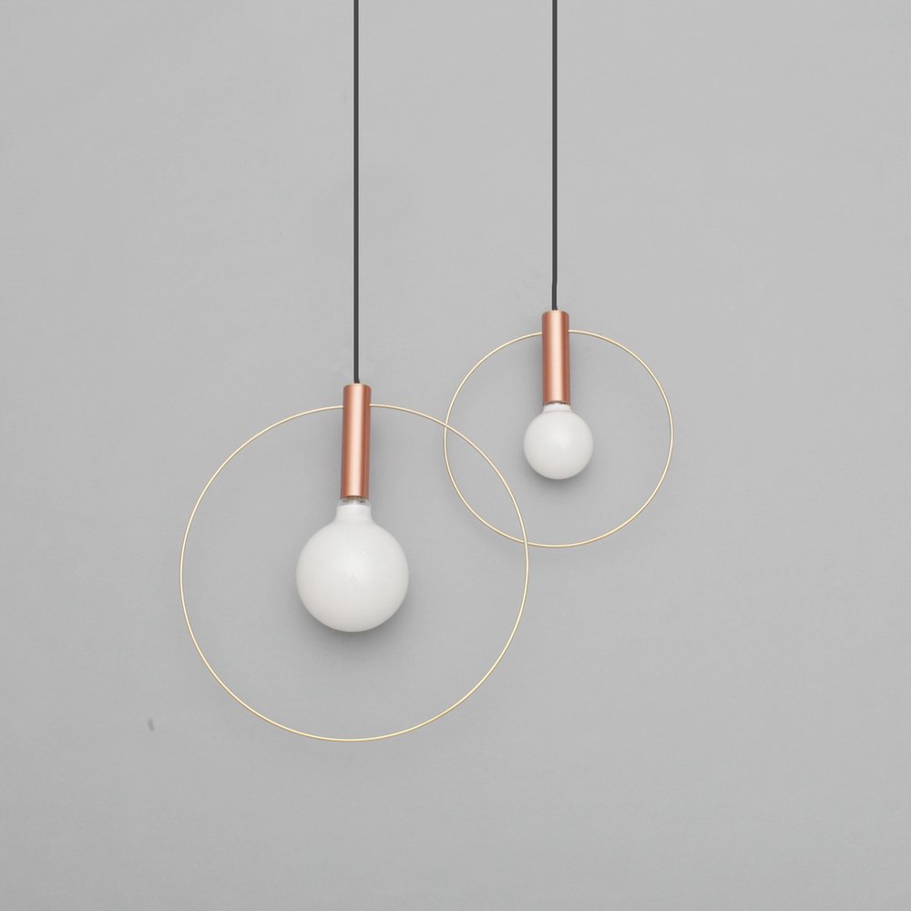 10" Aura Pendant Copper by Ladies & Gentlemen: Light pared down into its two elemental ingredients: the source (the bulb) and its illumination (highlighted by a brass ring) The resulting Aura pendant lights are simple and versatile. The two availa